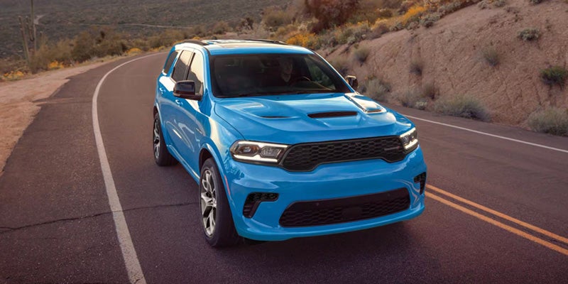Blue Dodge Durango driving